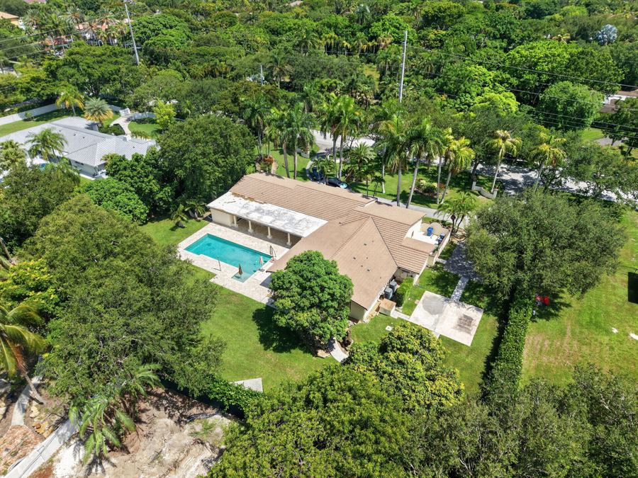 Aerial of a home set in mature trees