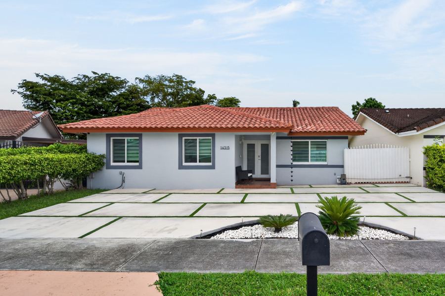 Tile roof home with modern paver drive, Miami