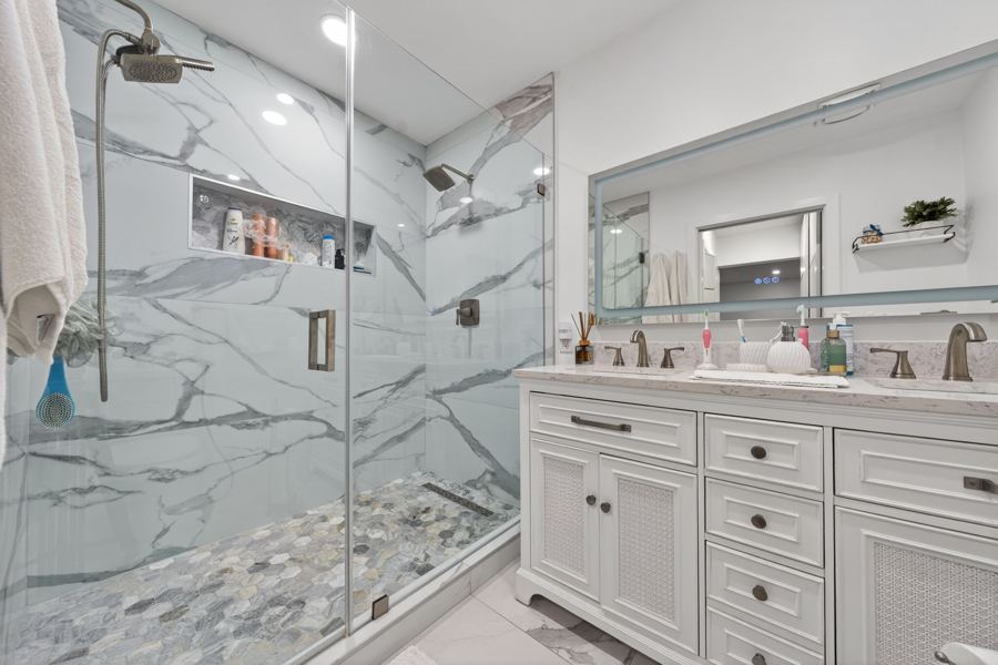 Marble walk in shower and double vanity