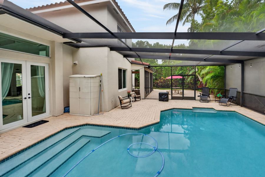 Pool steps under a screened cage, Palmetto Bay